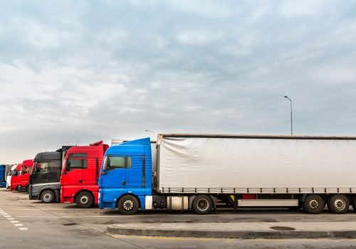 Trucks on parking, cargo transportation in European cities. Vehicles for for delivery of goods in Europe